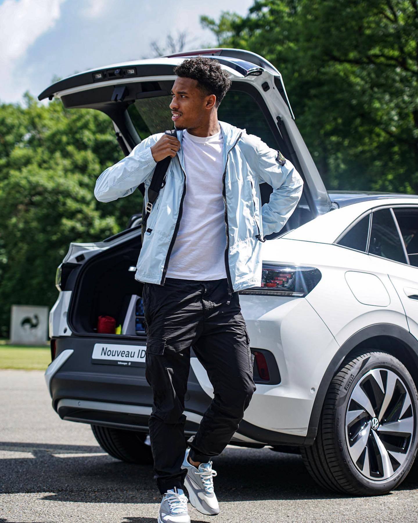 Boubacar Kamara Beside A Car Wallpaper