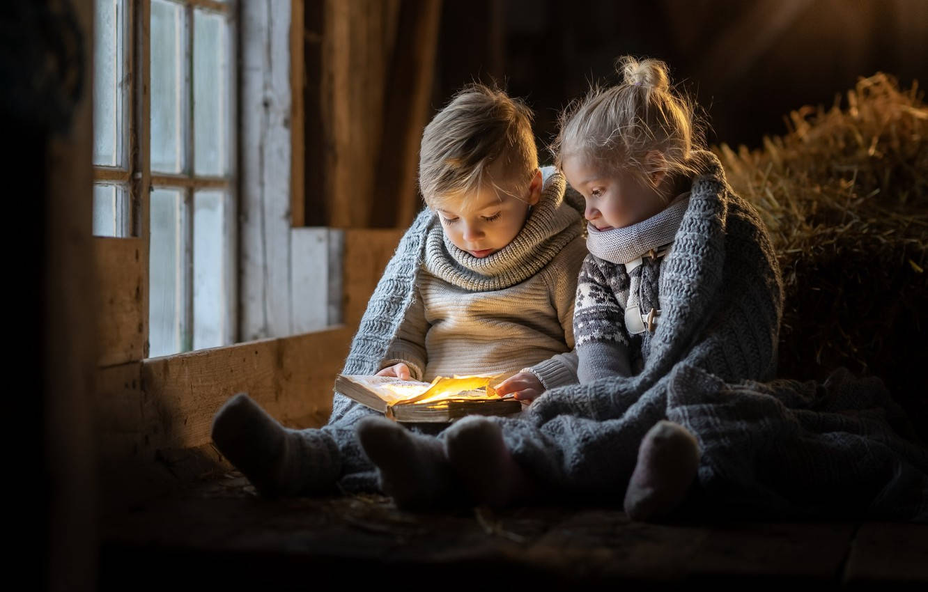 Boy And Girl Reading Book Wallpaper