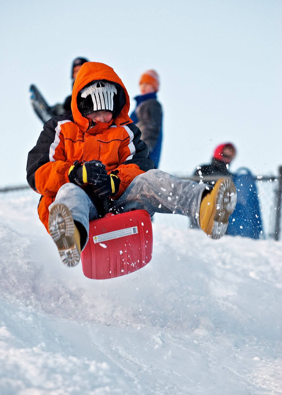 Boy Sledding Jumped Wallpaper