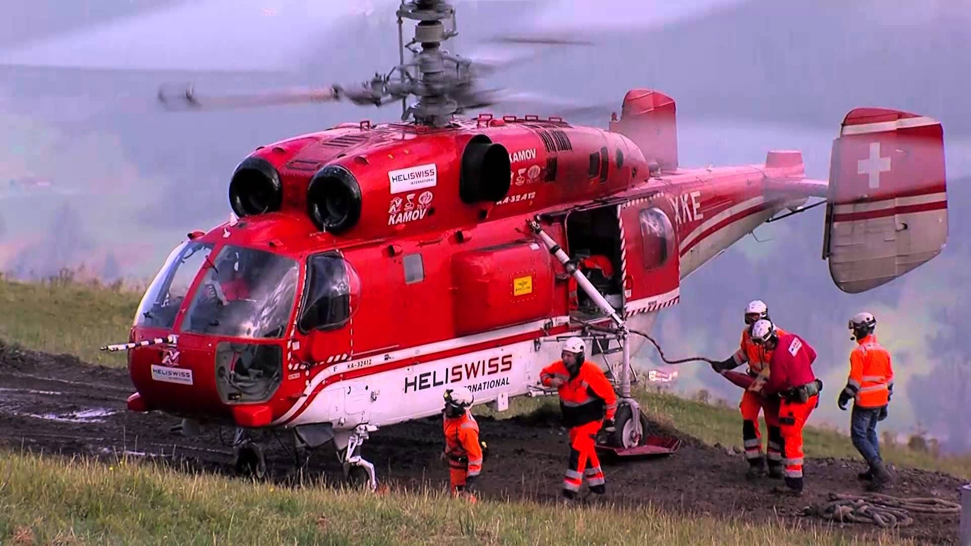 Brave Firefighters With Helicopter In Action Wallpaper