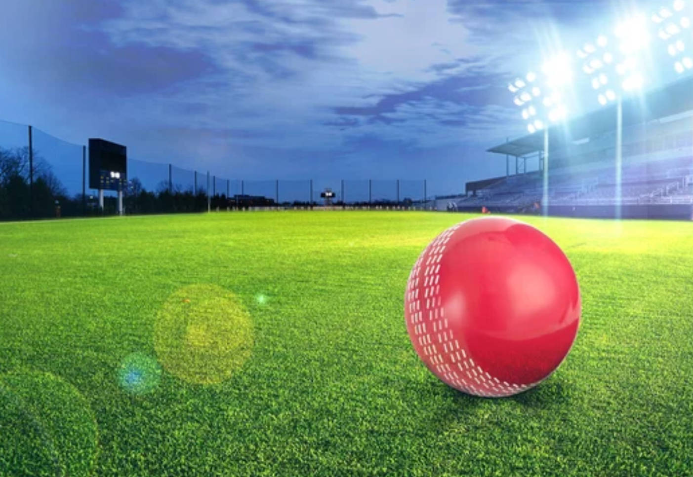 Breathtaking Cricket Ground Under Dazzling Lights Wallpaper