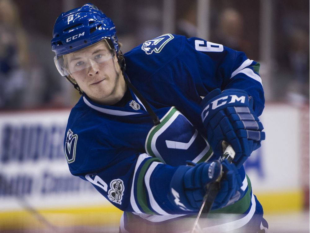 Brock Boeser Vancouver Canucks Hitting Goal Wallpaper