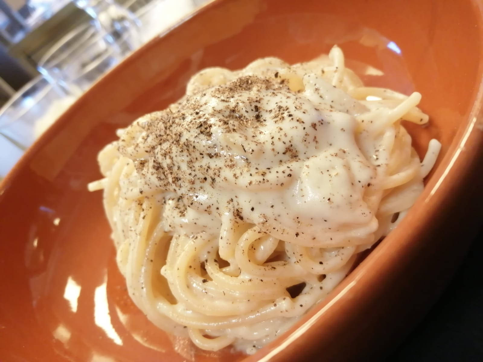 Cacio E Pepe On An Orange Plate Wallpaper