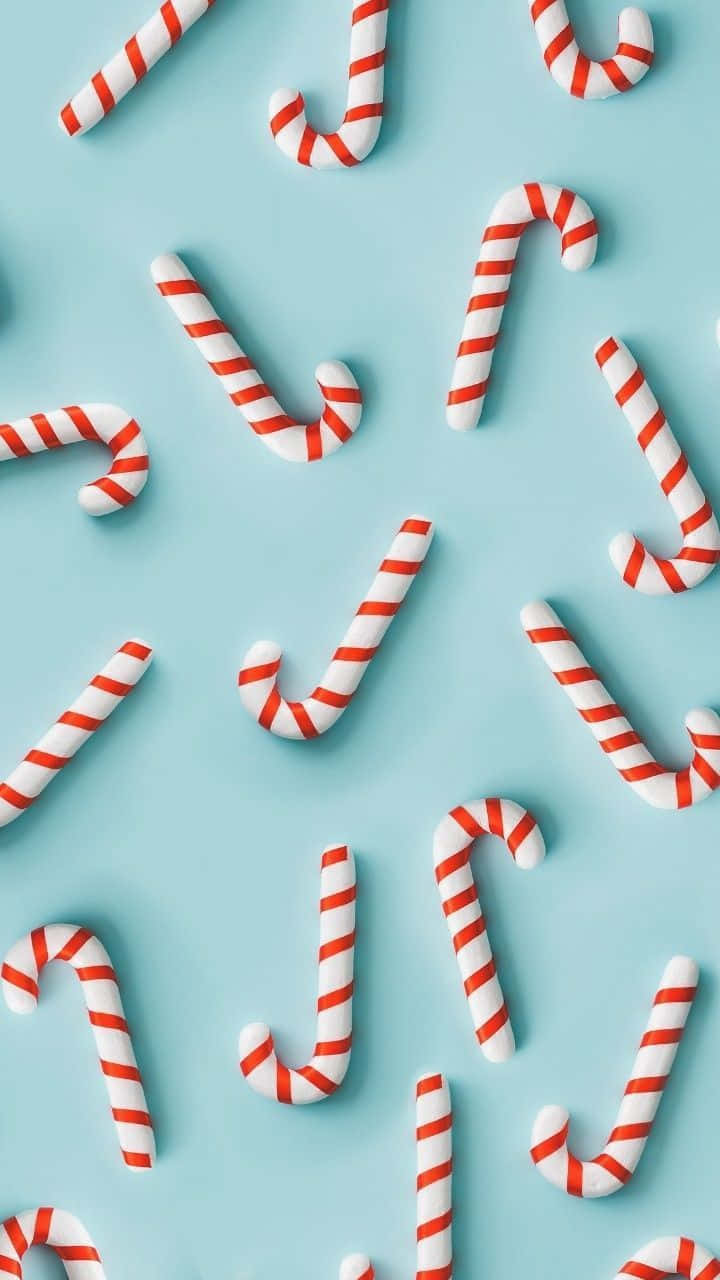 Candy Canes On A Blue Background Wallpaper