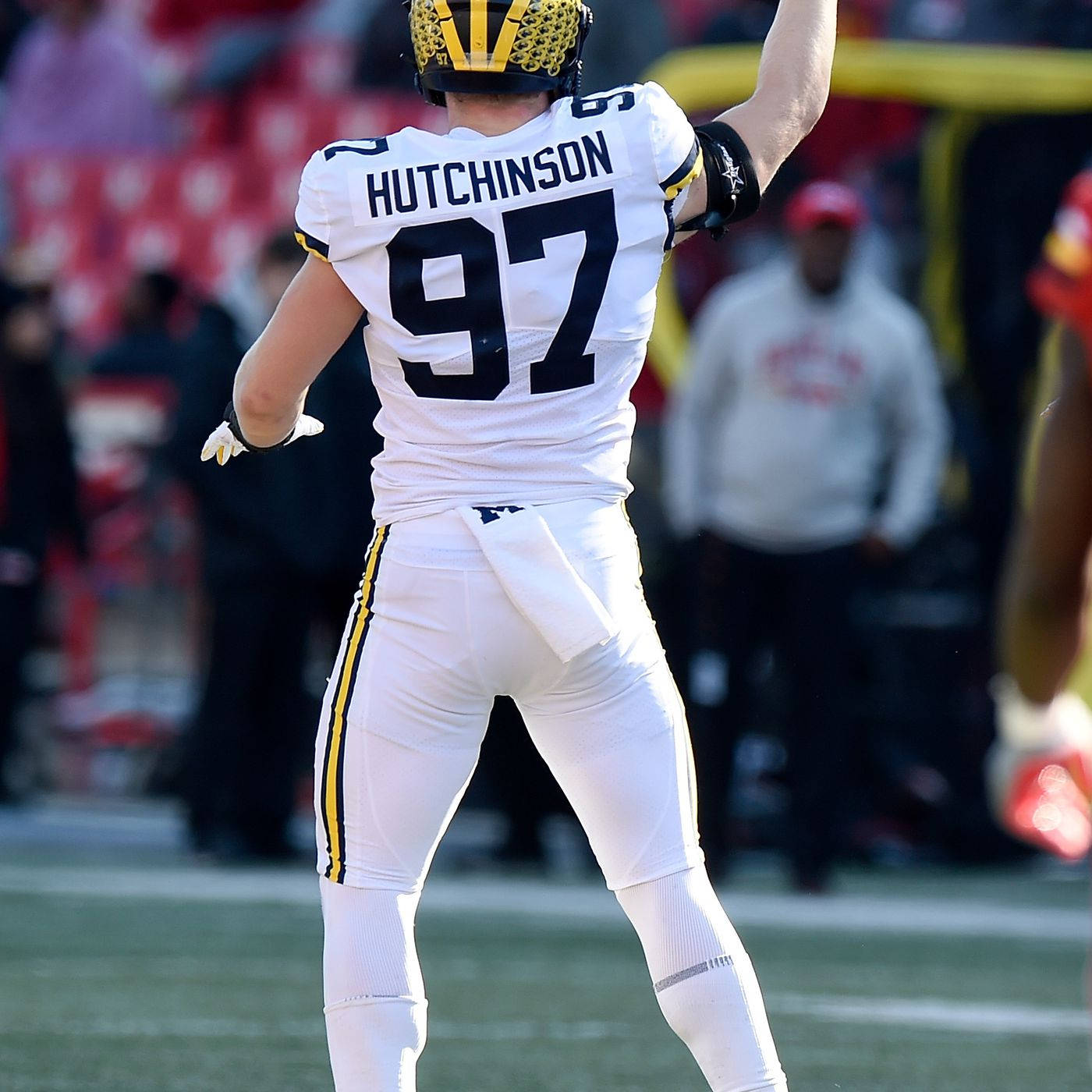 Caption: Aidan Hutchinson In Action For Michigan Wolverines In Ncaa Football Wallpaper