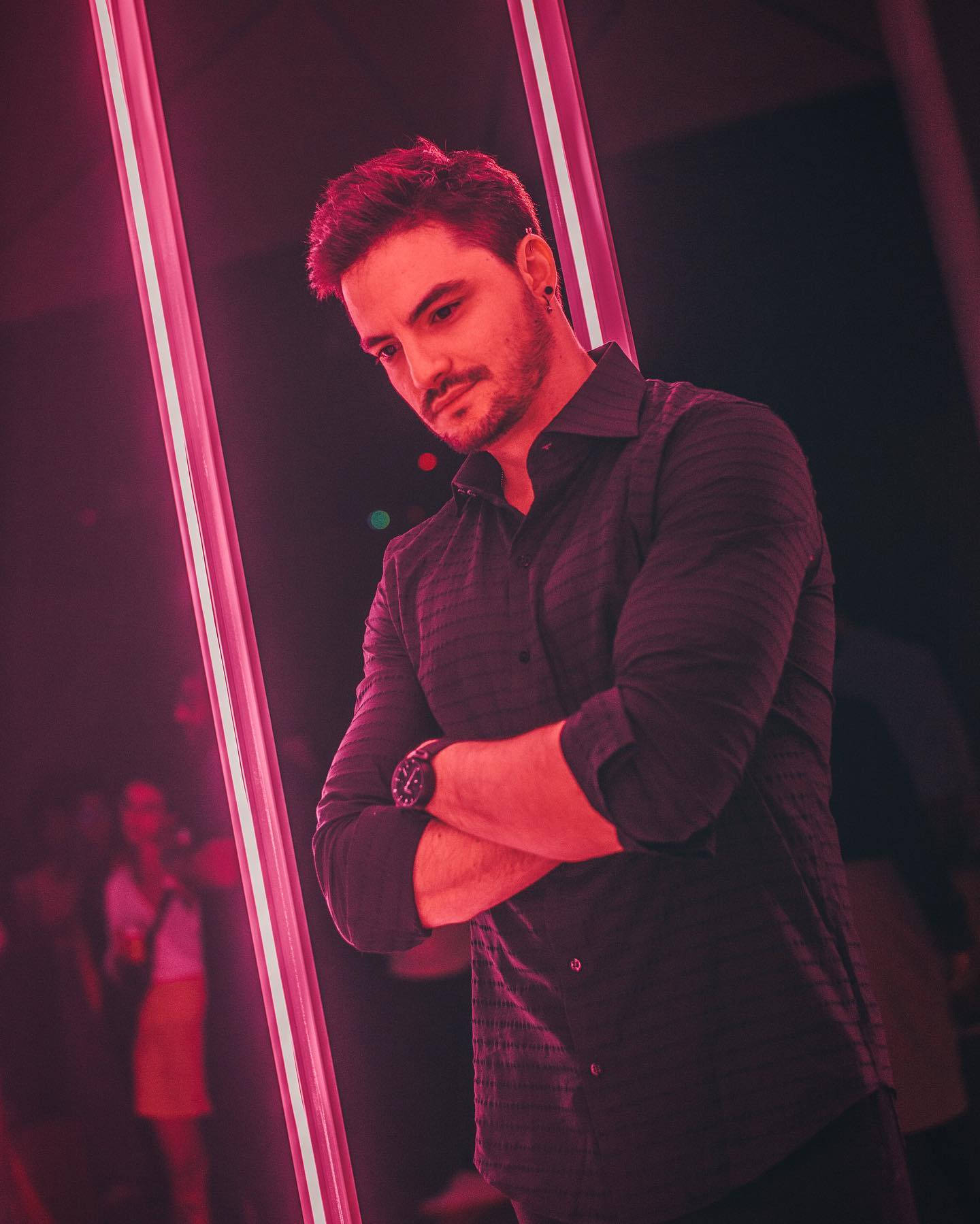 Caption: Brazilian Youtube Star Felipe Neto Under Neon Lights Wallpaper