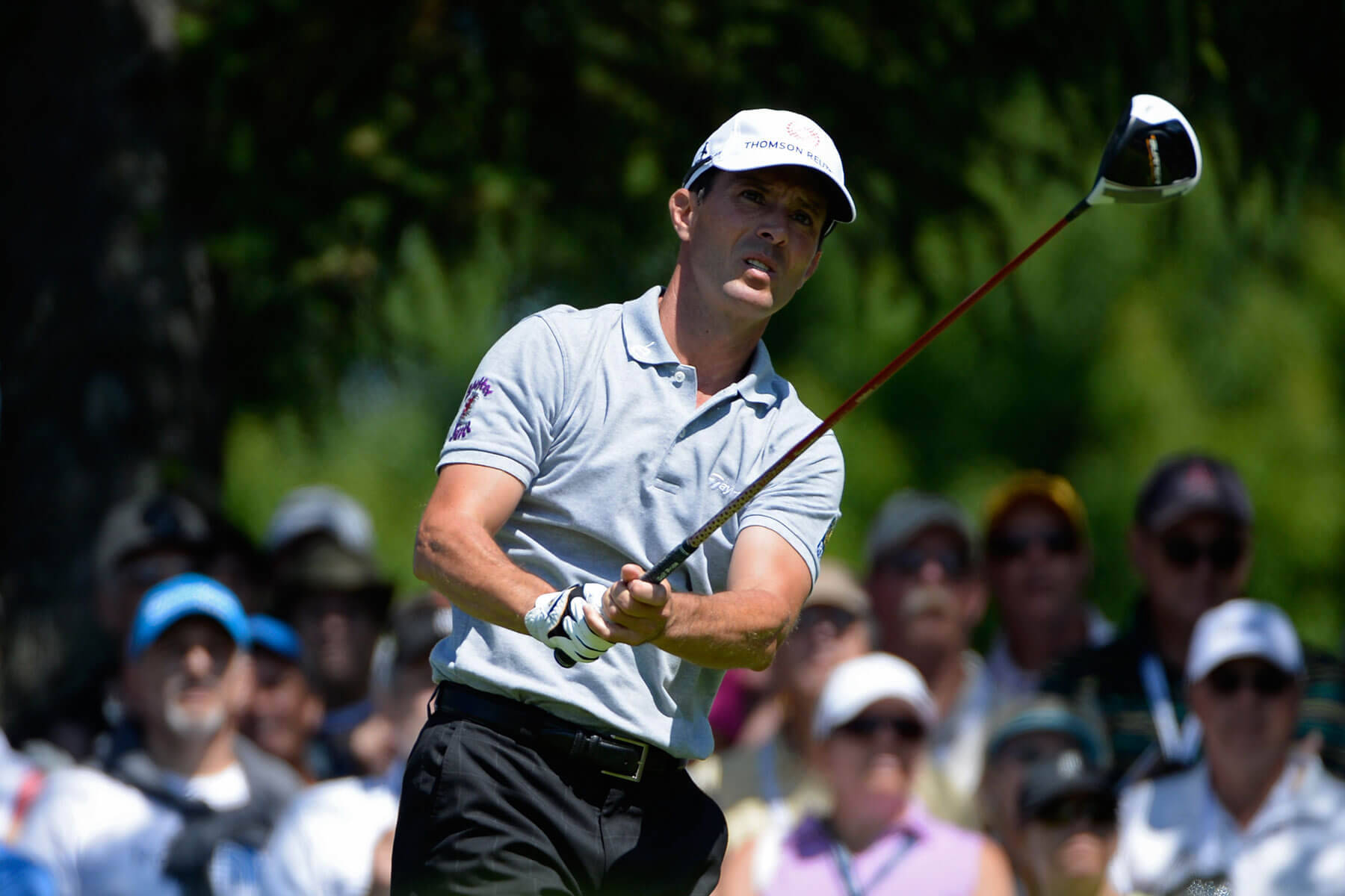 Caption: Canadian Golfer Mike Weir Swinging Under Sunny Skies Wallpaper