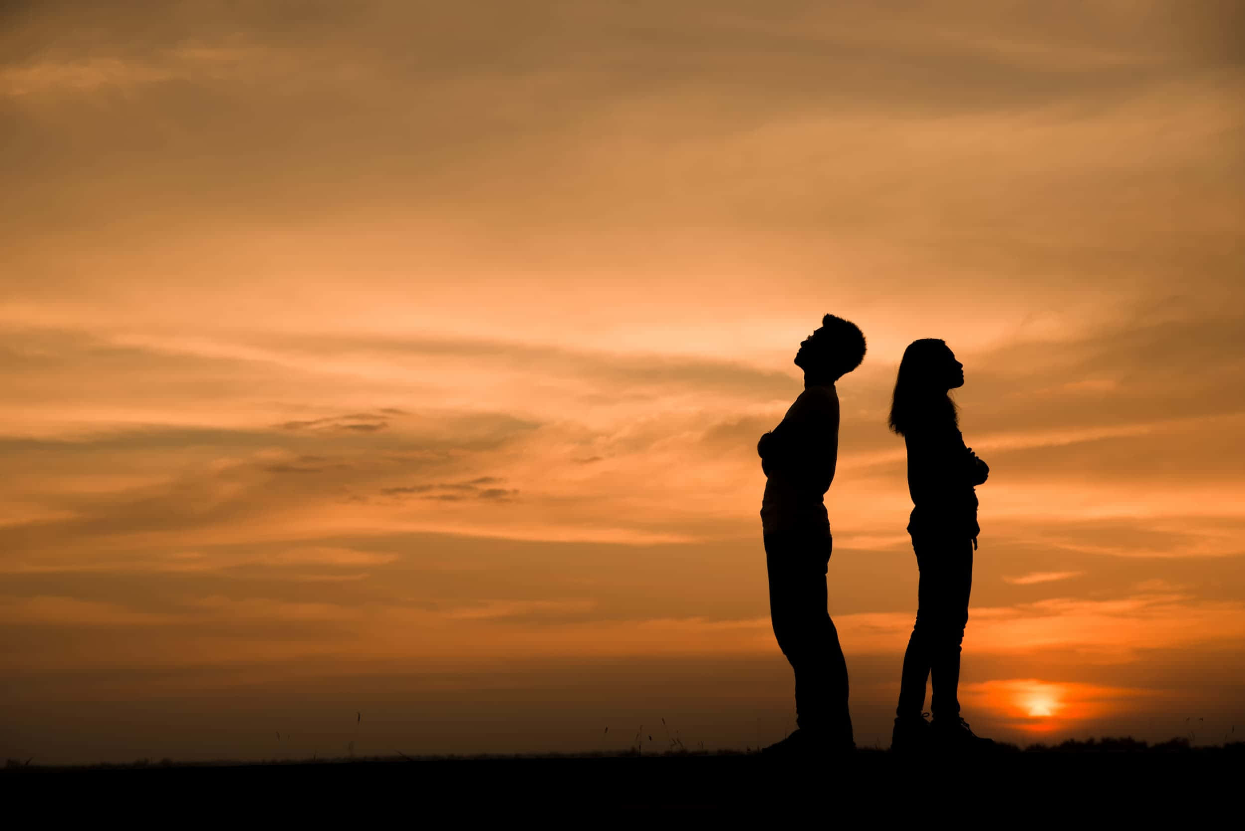 Caption: Embracing Love Under The Night Sky Wallpaper