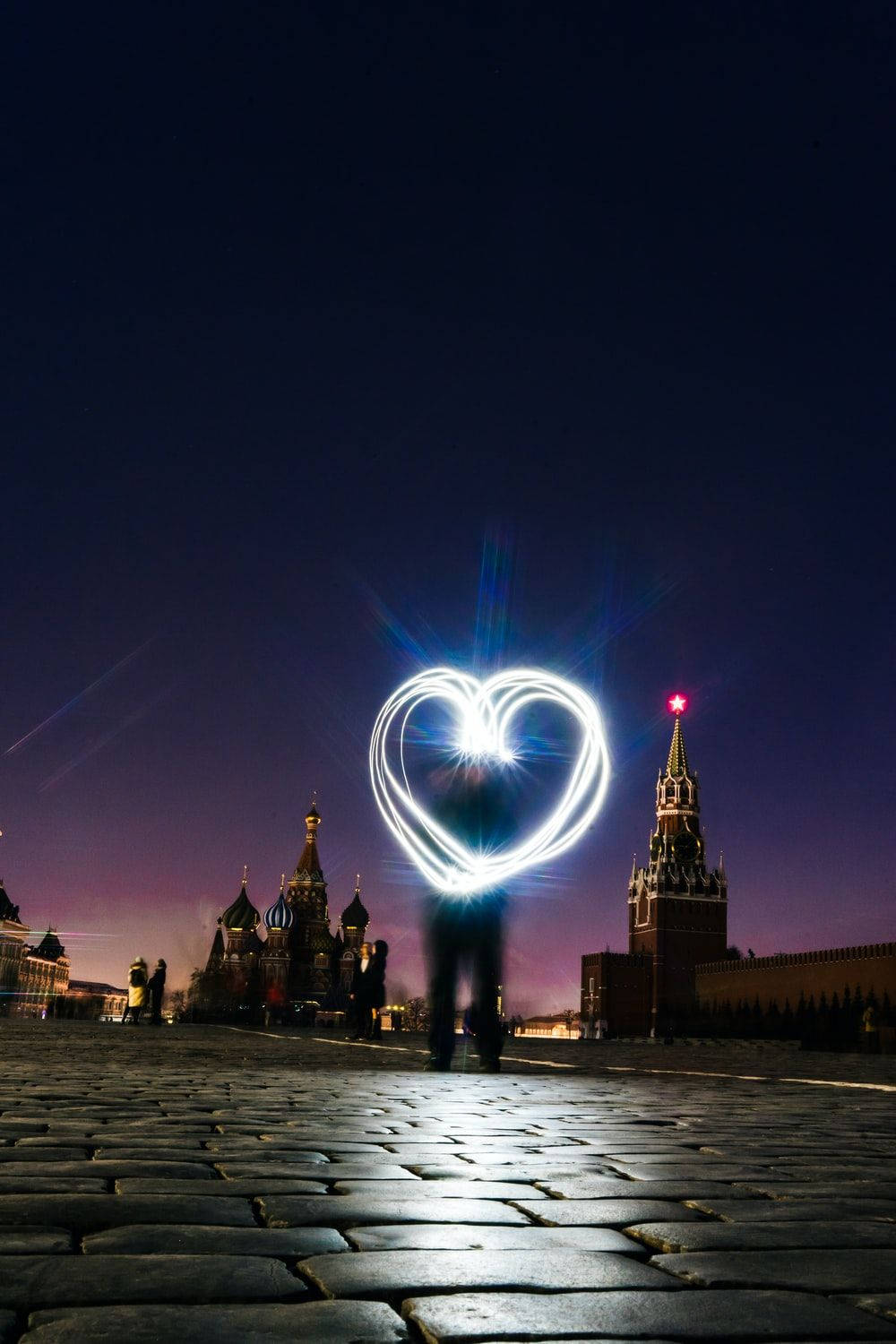 Caption: Illuminated Heart On Indie Phone Wallpaper