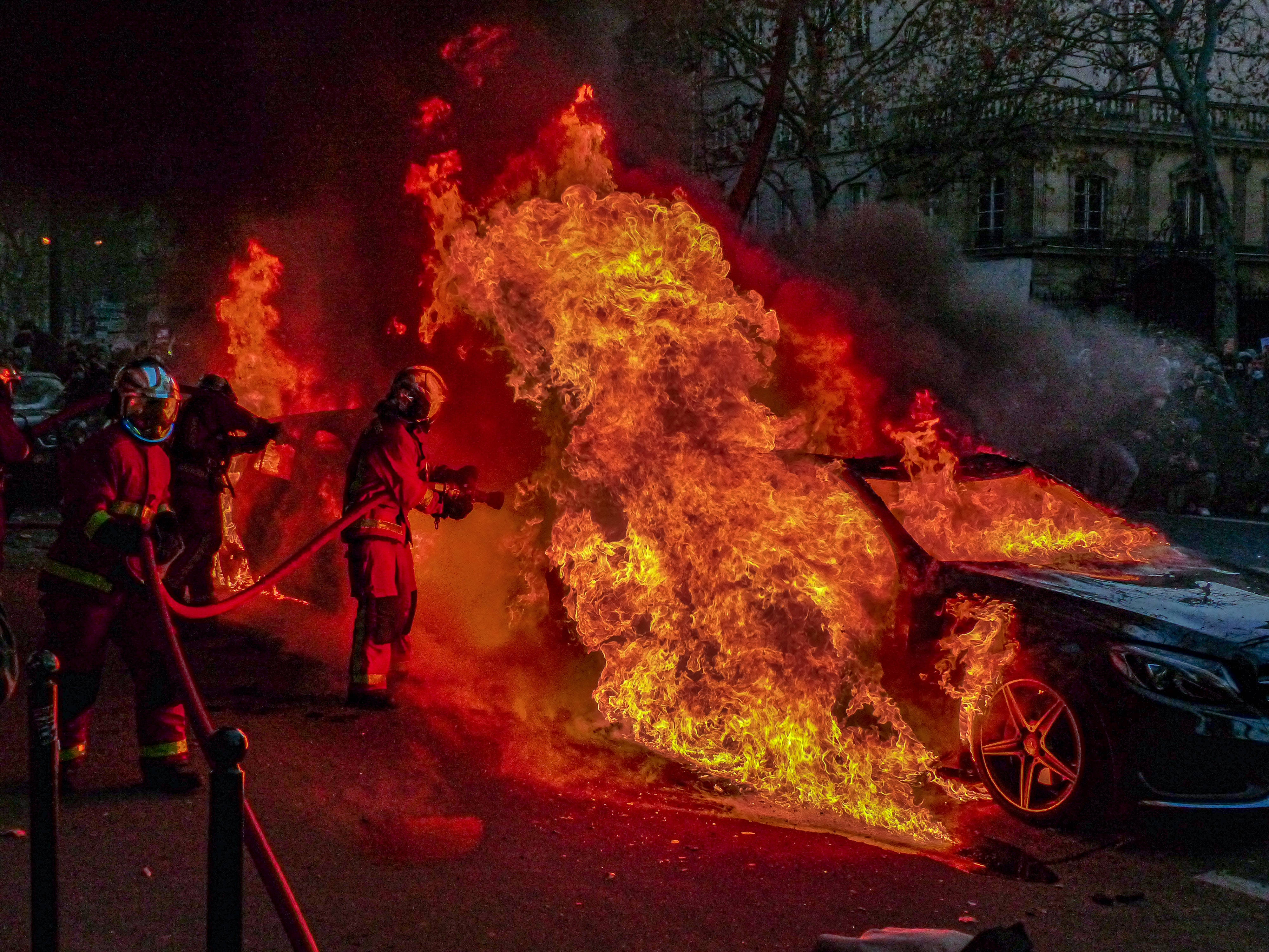 Caption: Intense Car Accident Scene On A City Street Wallpaper