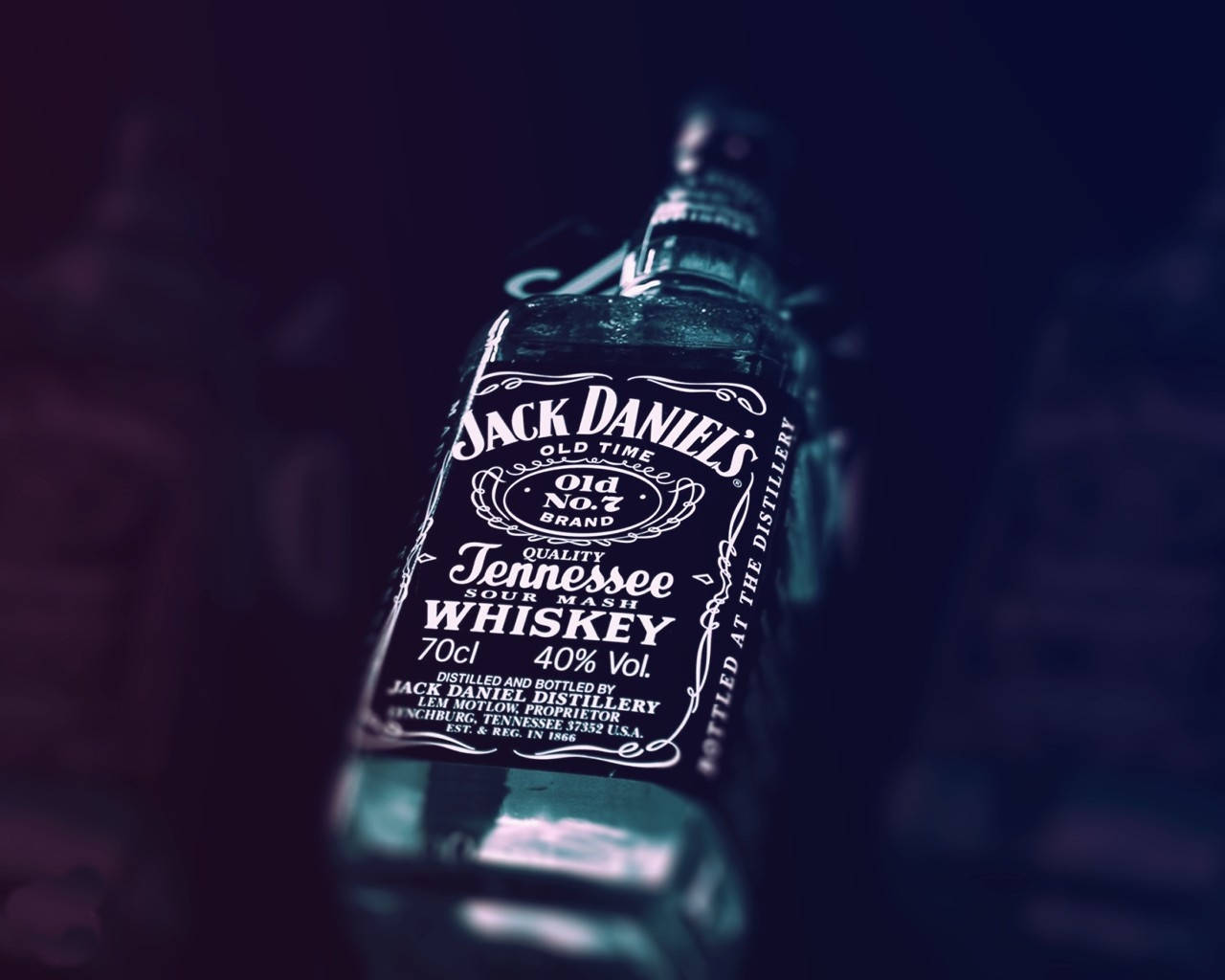 Caption: Jack Daniels Bottled Whiskey Showcase Wallpaper