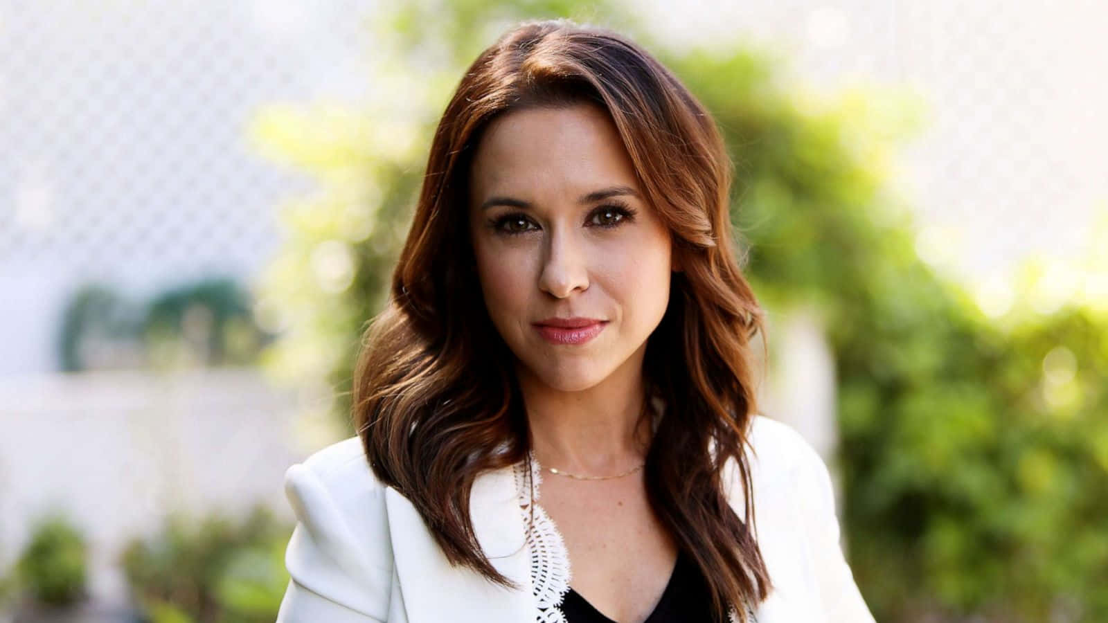 Caption: Lacey Chabert Posing Gracefully For A Photoshoot Wallpaper