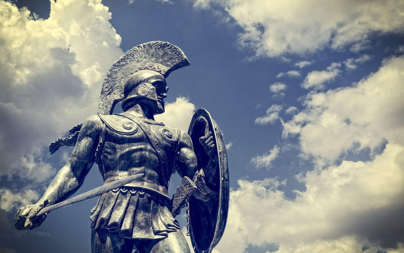 Caption: Majestic Greek Warrior Statue Wallpaper