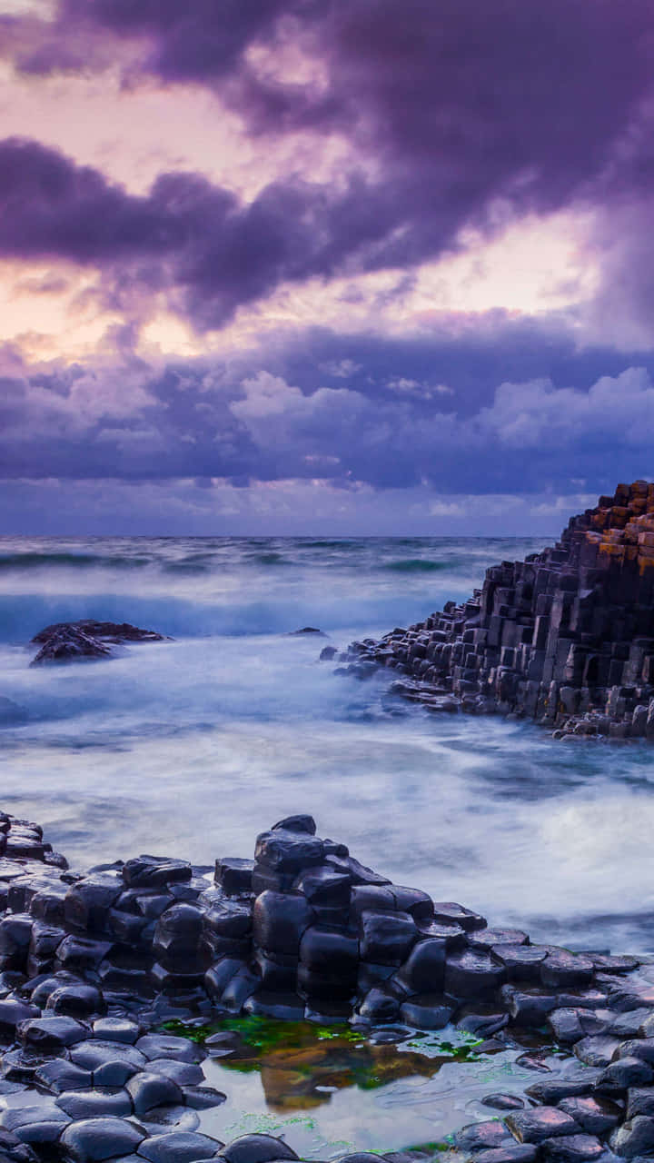 Caption: Majestic High Tide At Giant’s Causeway, Northern Ireland Wallpaper