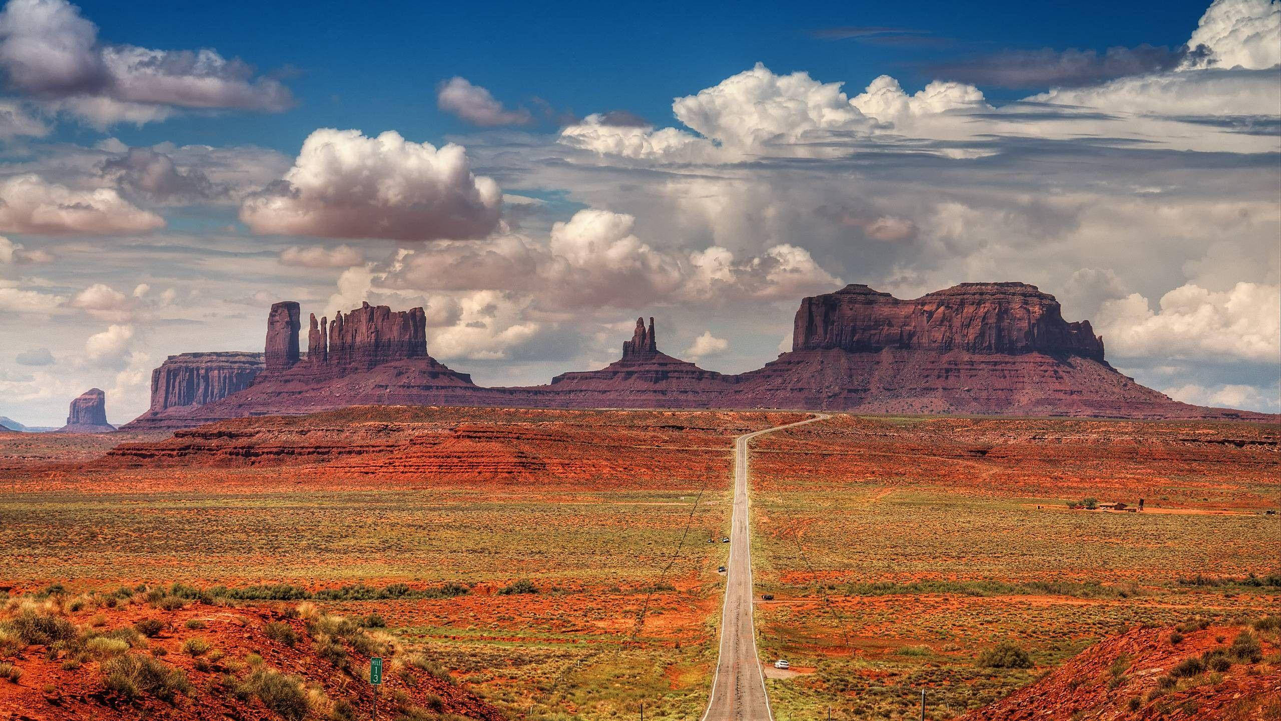 Caption: Majestic Sunset Over Rustic Western Mesas Wallpaper