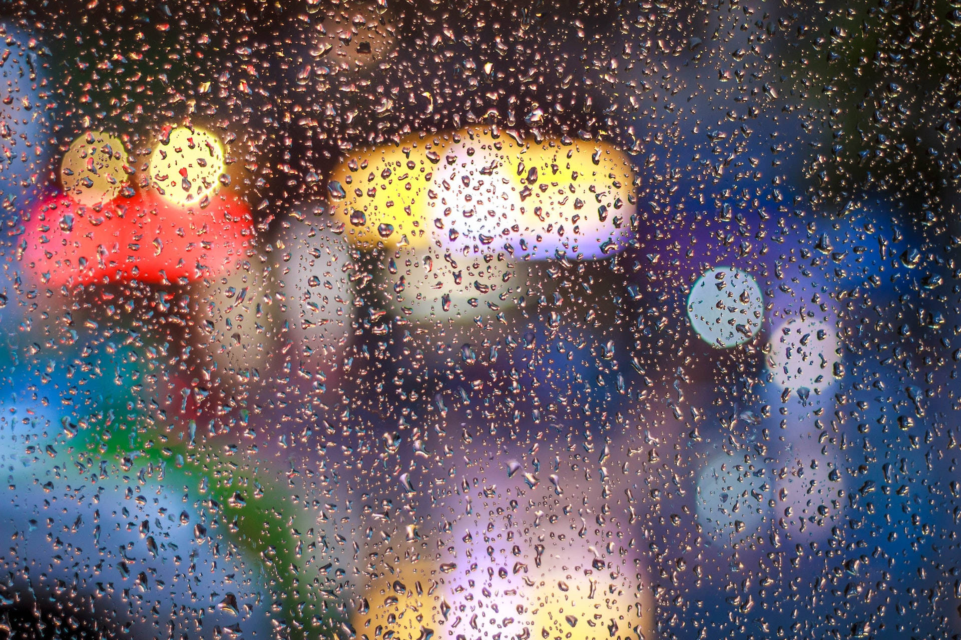 Caption: Mesmerizing View Through Wet Glass Wallpaper