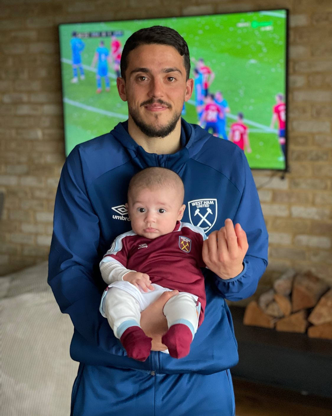 Caption: Rising Soccer Star Pablo Fornals Watching A Game At Home Wallpaper