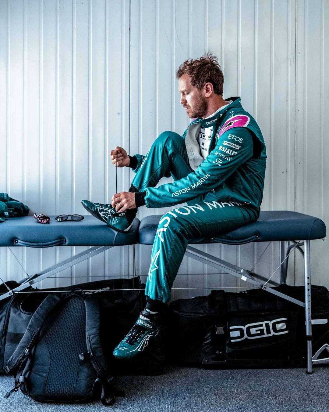 Caption: Sebastian Vettel Relaxing On A Bench Wallpaper