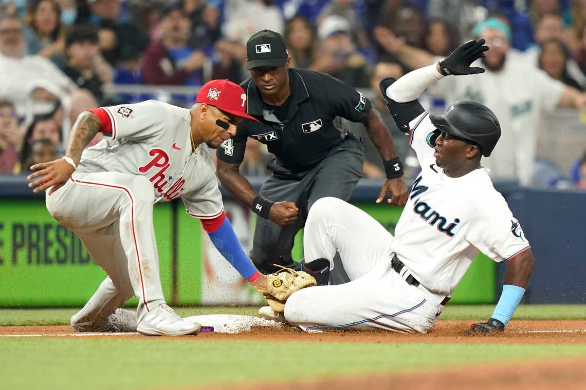 Caption: Spirited Clash Between Philadelphia Phillies And Miami Marlins At Major League Baseball Game Wallpaper