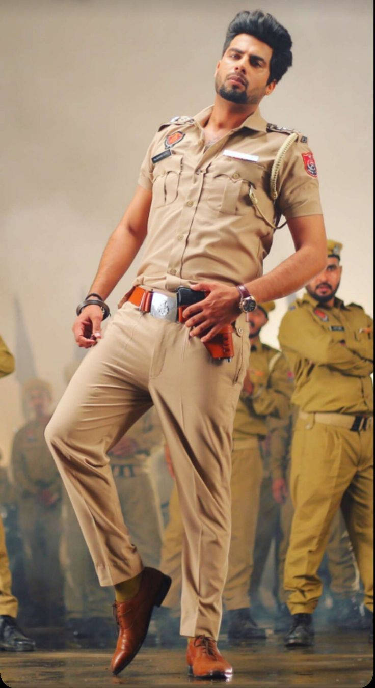 Caption: The Power Of Law: An Indian Police Officer In Action Wallpaper