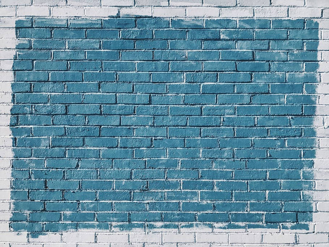 Captivating Blue Paint On A Brick Wall Wallpaper