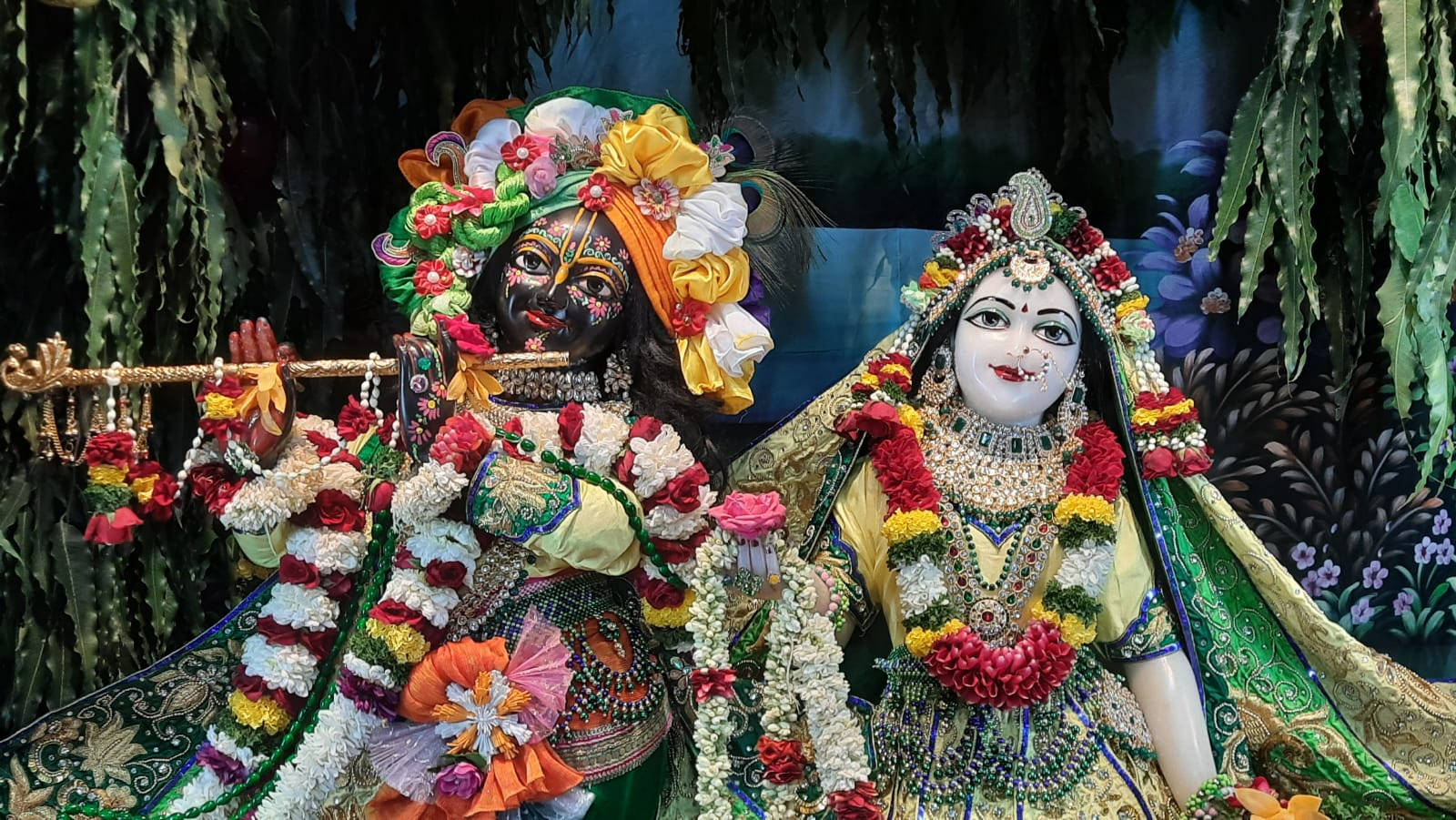 Captivating Divine Scene Of Radha And Krishna At Iskcon Wallpaper