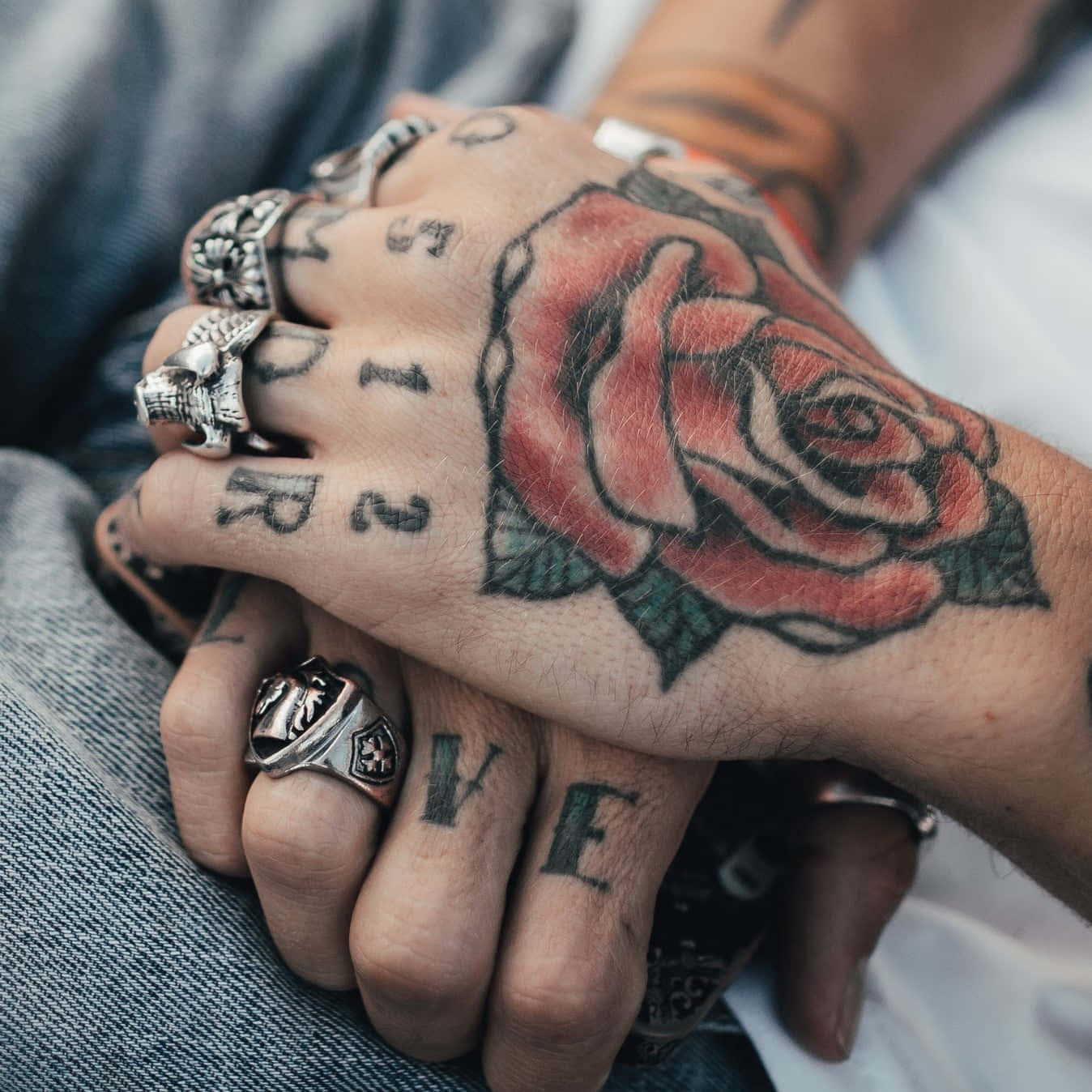 Captivating Red Rose Hand Tattoo Close Up Shot Wallpaper