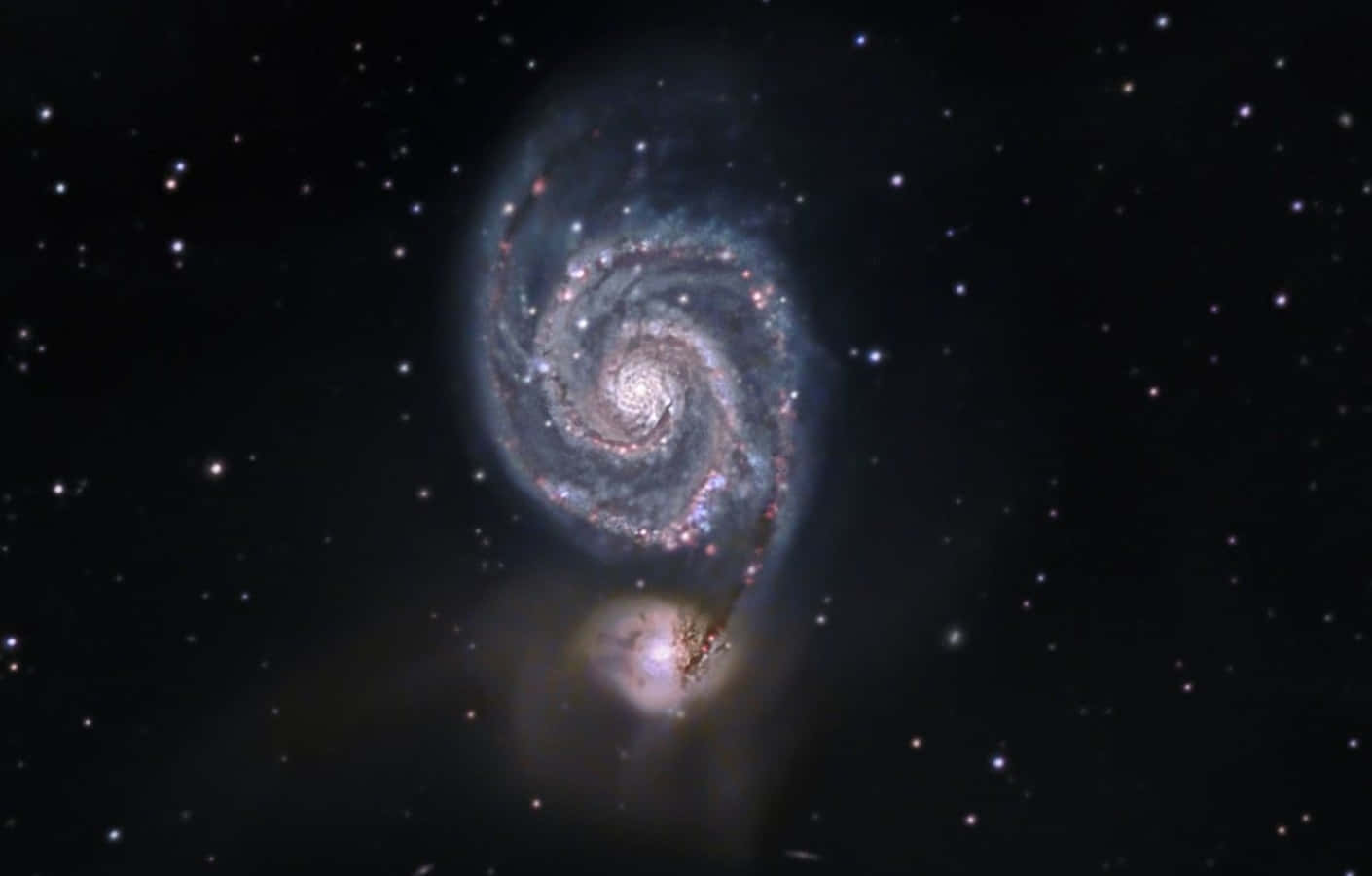 Captivating Whirlpool Galaxy In The Night Sky Wallpaper