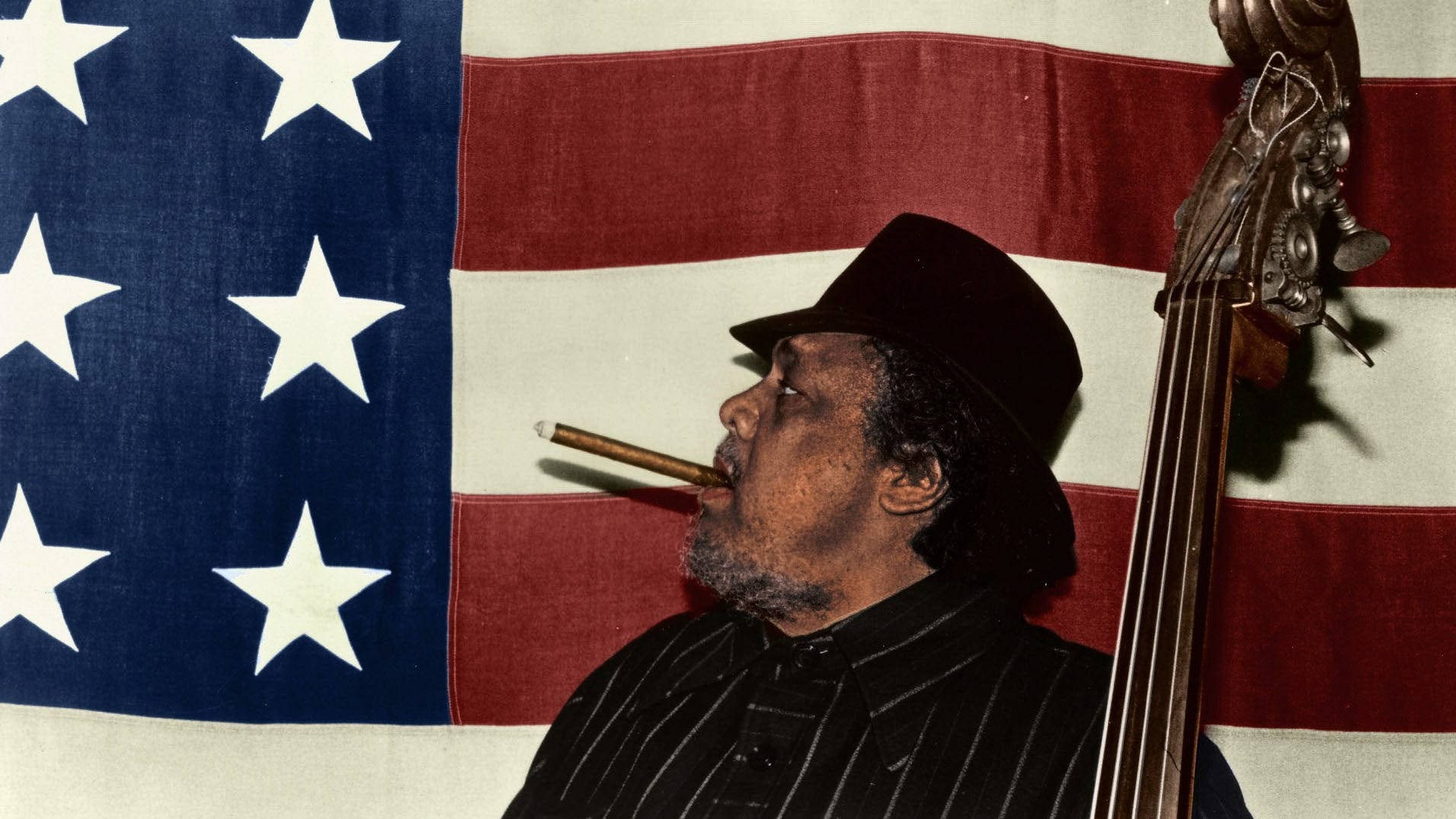 Charles Mingus On A Us Flag Background Wallpaper