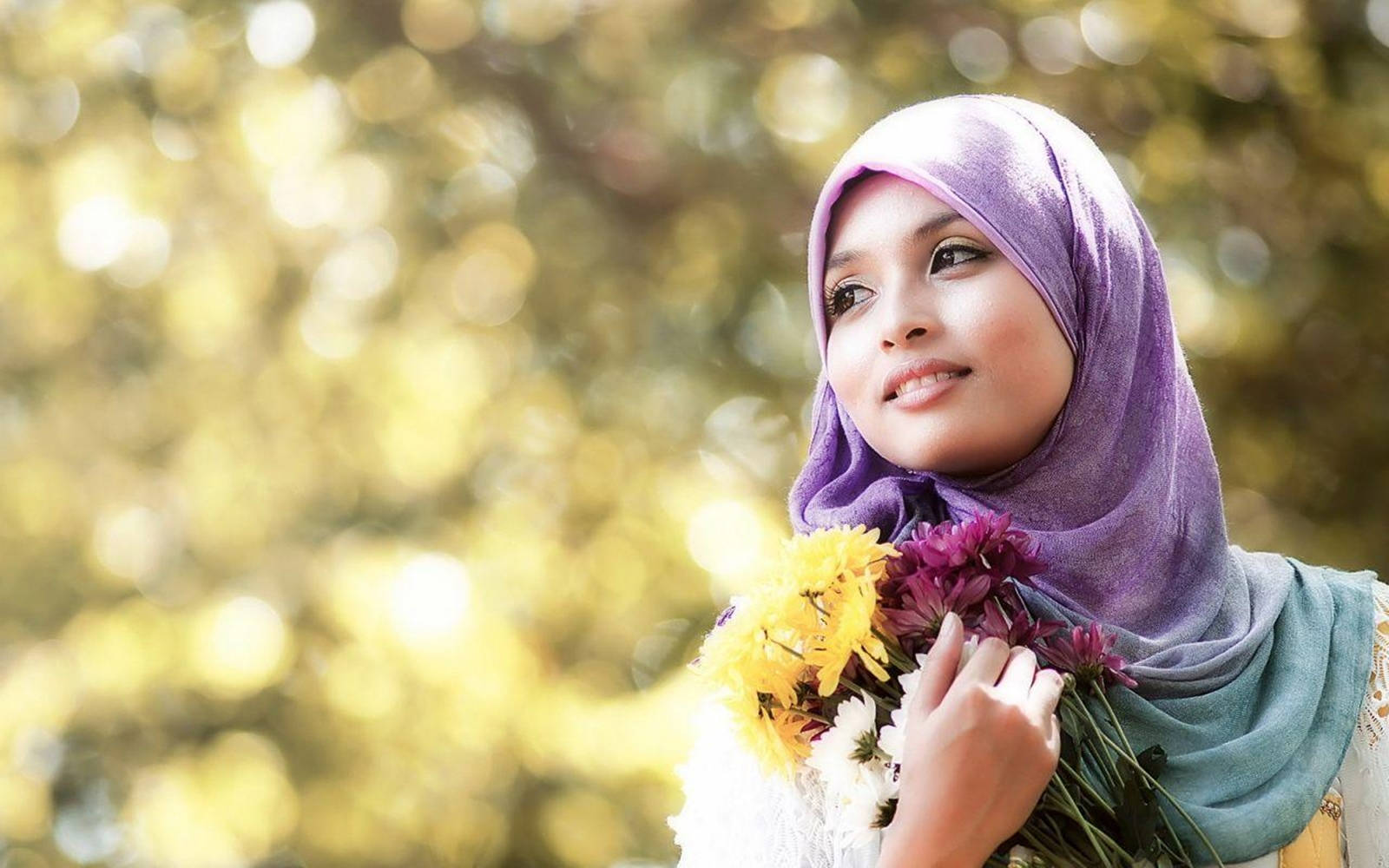 Charming Hijab Girl Holding Flowers Wallpaper
