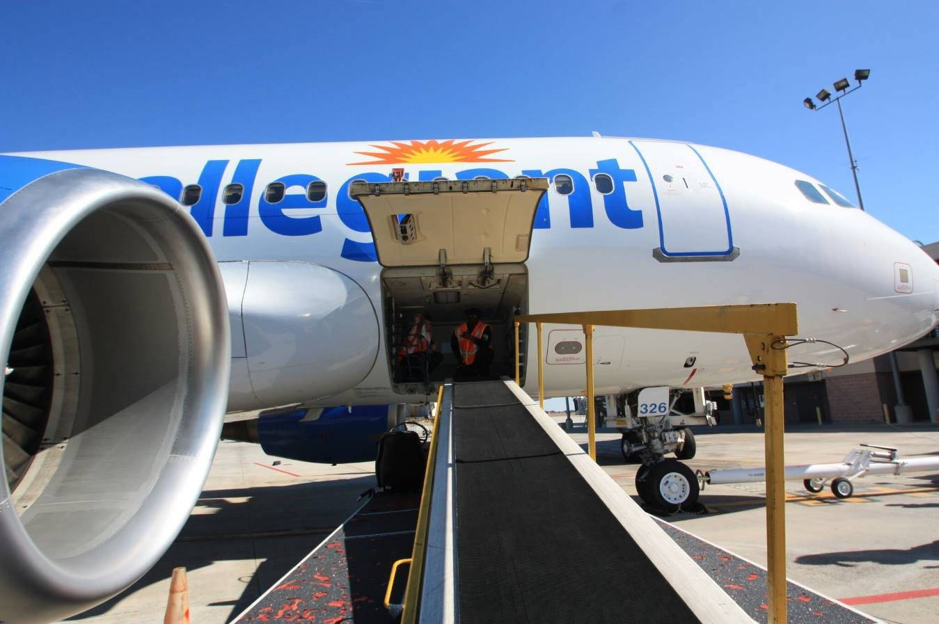 Checked Baggage Ready For Flight With Allegiant Air Wallpaper