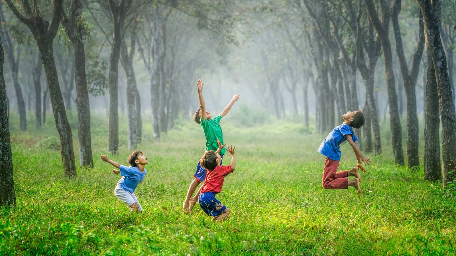 Children Jumping In The Forest Wallpaper