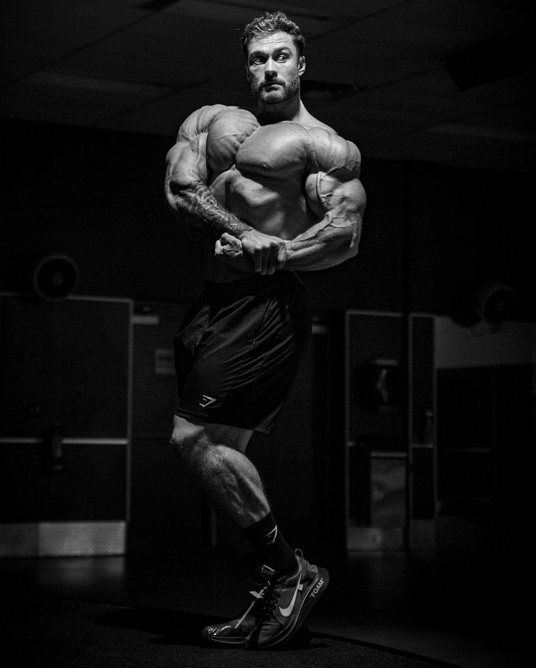 Chris Bumstead With Side Chest Pose Wallpaper