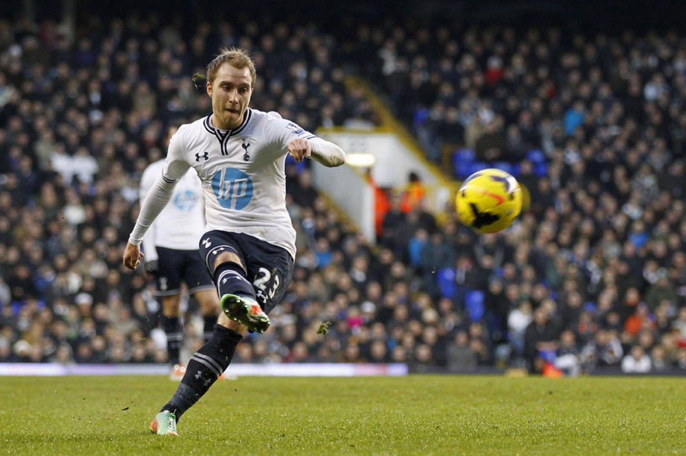 Christian Eriksen Wearing White And Kicking The Ball Wallpaper