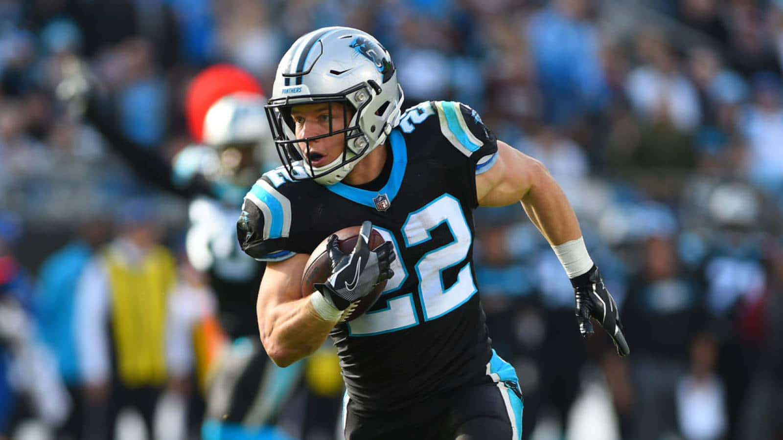 Christian Mccaffrey Breaking Off A Huge Gain For The Carolina Panthers Wallpaper