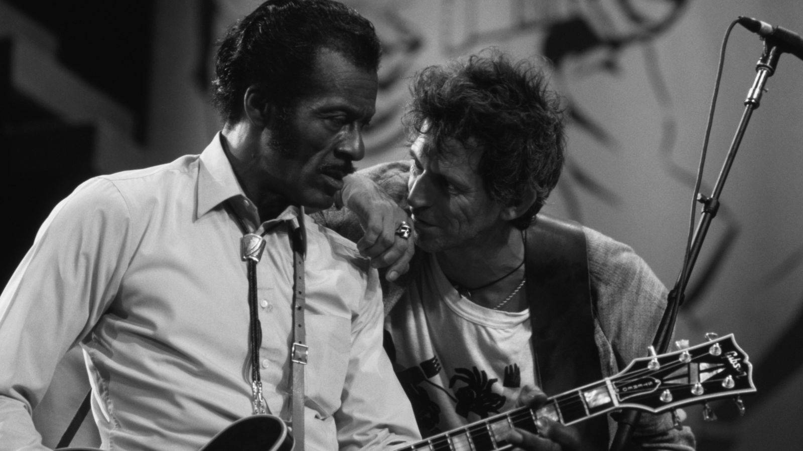Chuck Berry And Keith Richard Sharing A Musical Moment Wallpaper