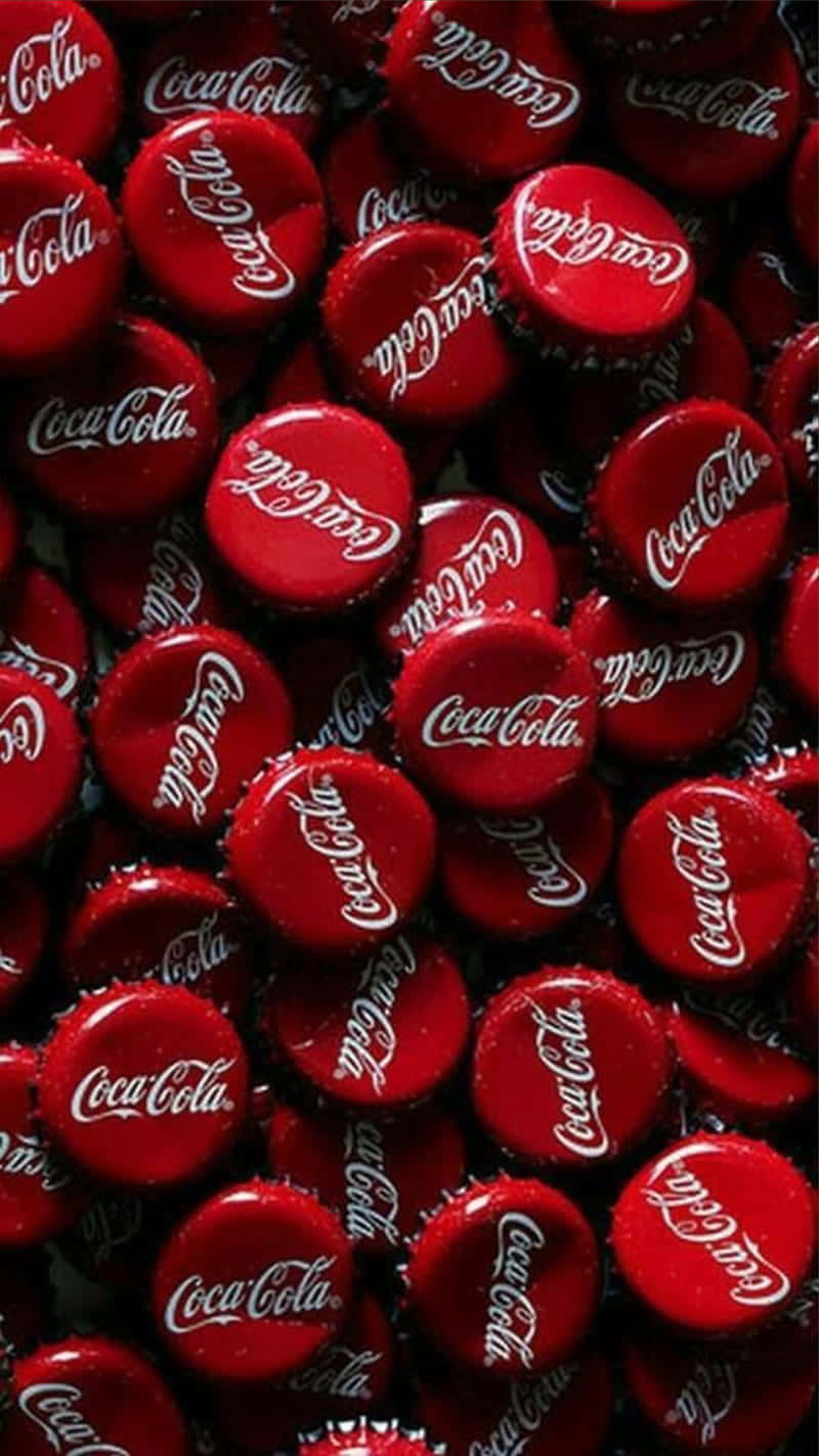 Coca Cola Bottle Caps In A Pile Wallpaper