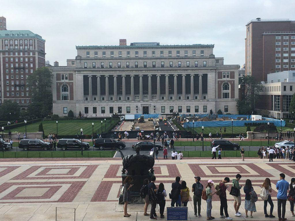 Columbia University Students Near The Sculpture Wallpaper