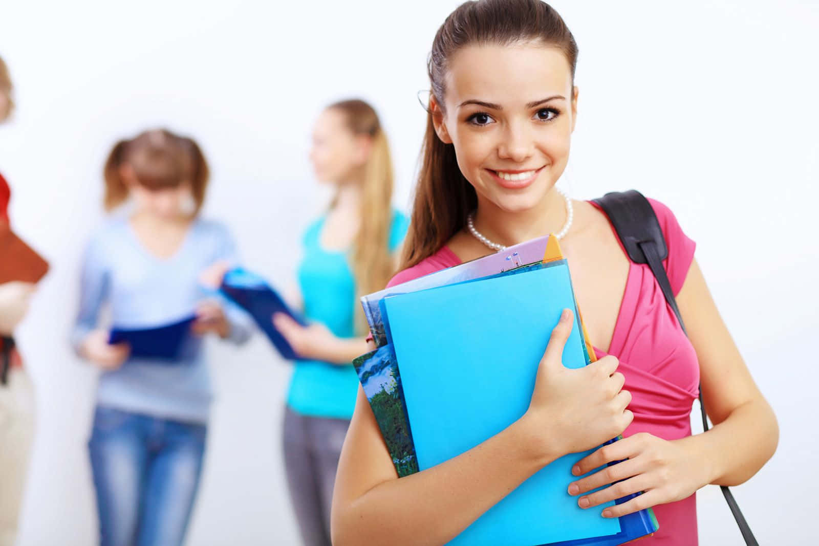 Confident Student With Books Wallpaper