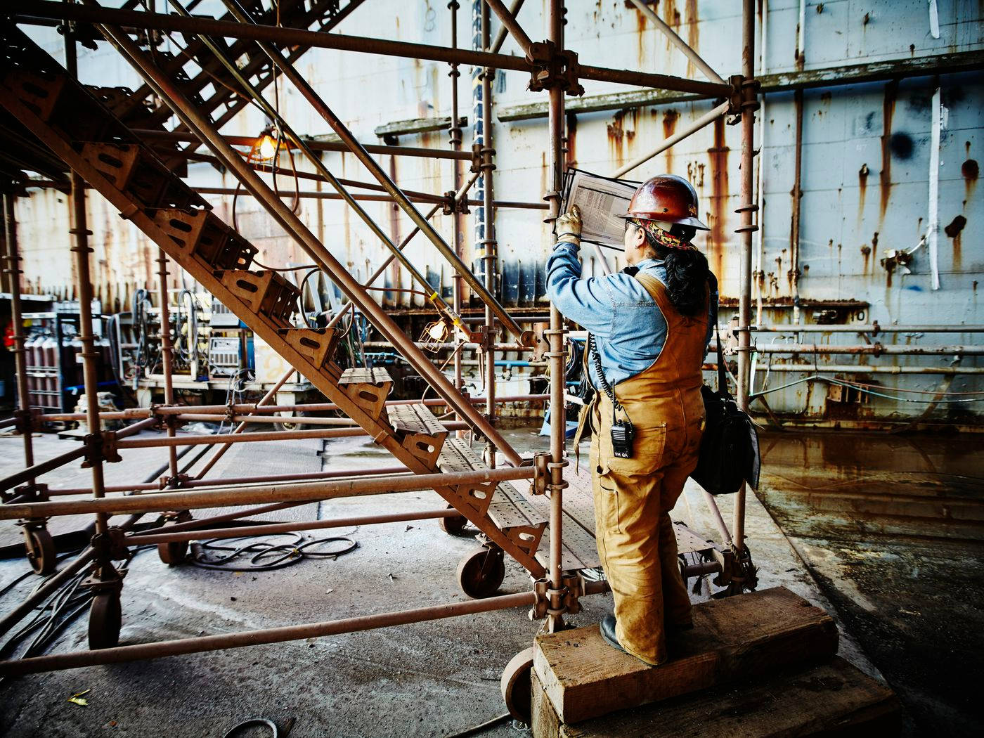 Construction Worker Standing Inside The Construction Area Wallpaper