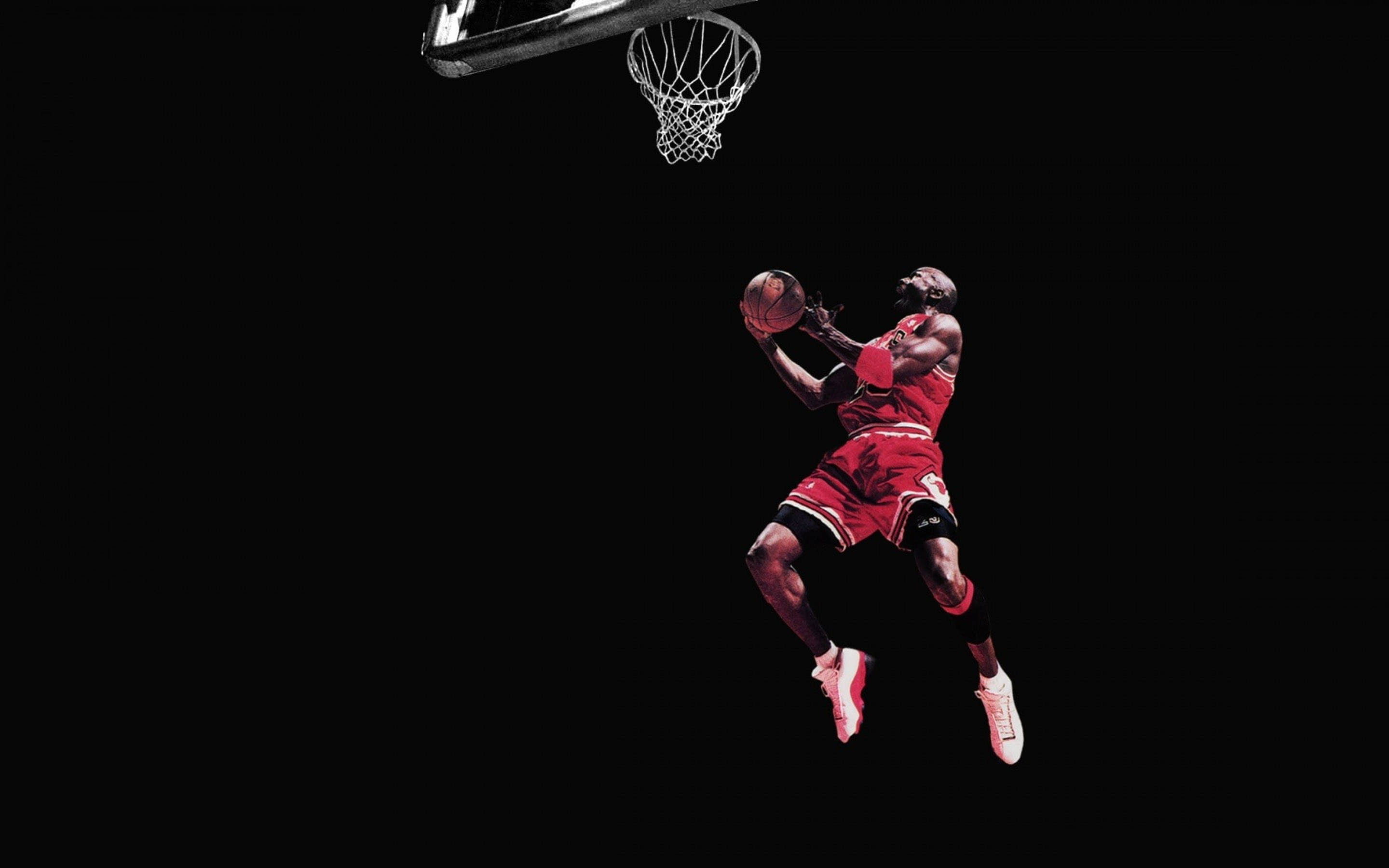Cool Jordan In Mid-air Moment Wallpaper