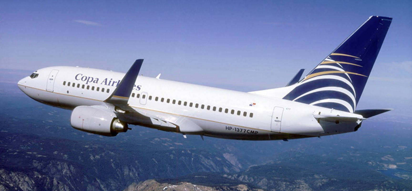 Copa Airlines Plane Above Mountain Peak Wallpaper