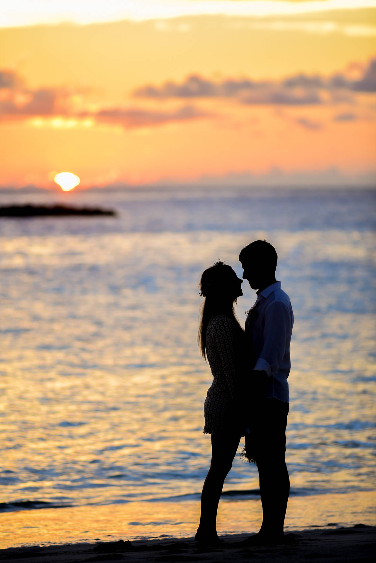 Couple In Love On Seashore Wallpaper