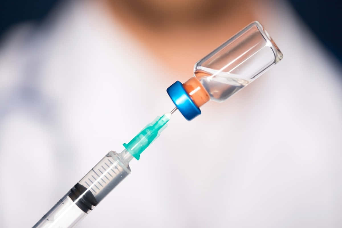 Covid-19 Vaccine Syringe Preparation Wallpaper