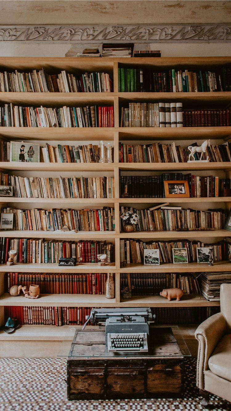 Cozy Room With Wooden Bookshelf Wallpaper