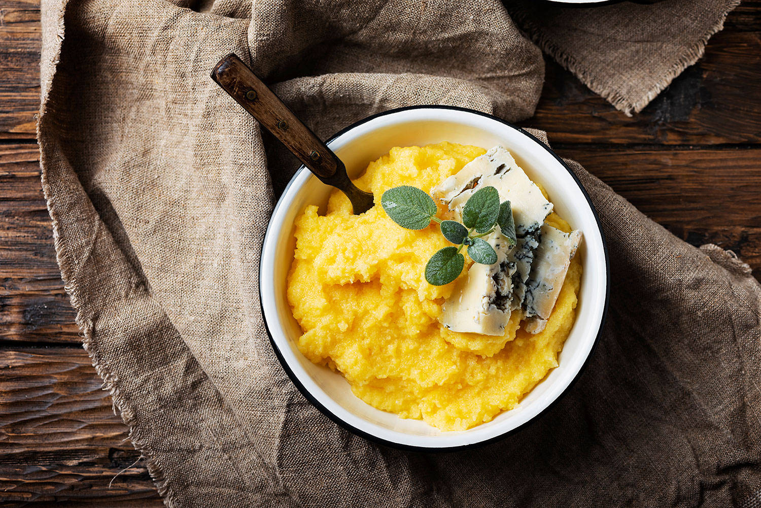 Creamy Gorgonzola Polenta Dish - An Artful Blend Of Italian Flavors Wallpaper