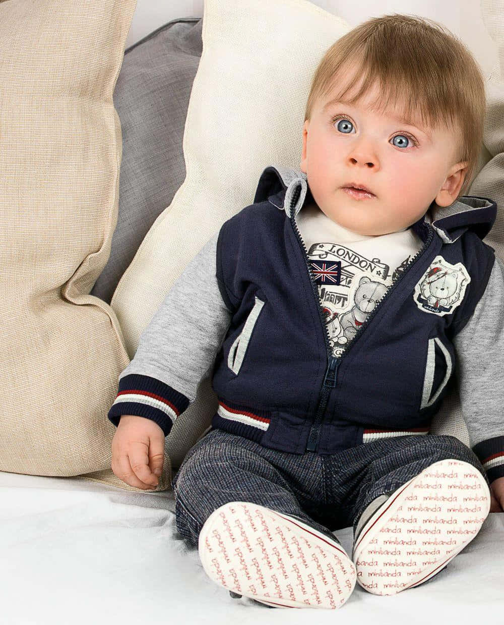 Cute Baby Stylish Boy Sitting Wallpaper