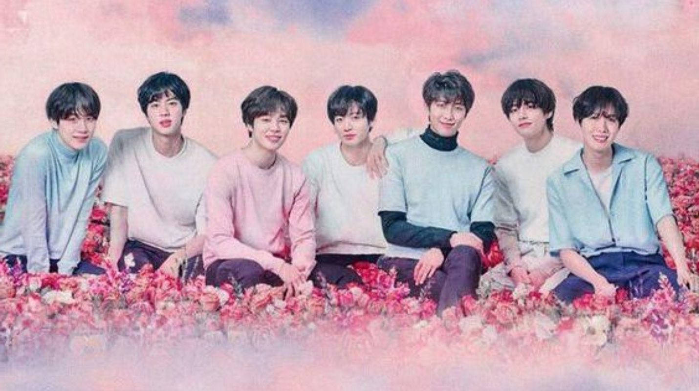 Cute Bts Group On A Pink Flower Field Wallpaper