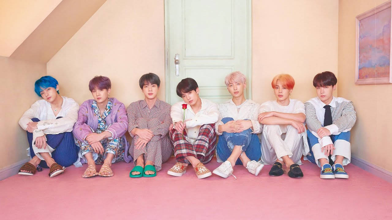 Cute Bts Group Sitting Together On The Attic Wallpaper