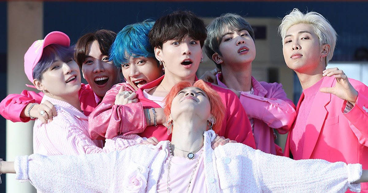 Cute Bts Group Wearing Pink Suits Wallpaper